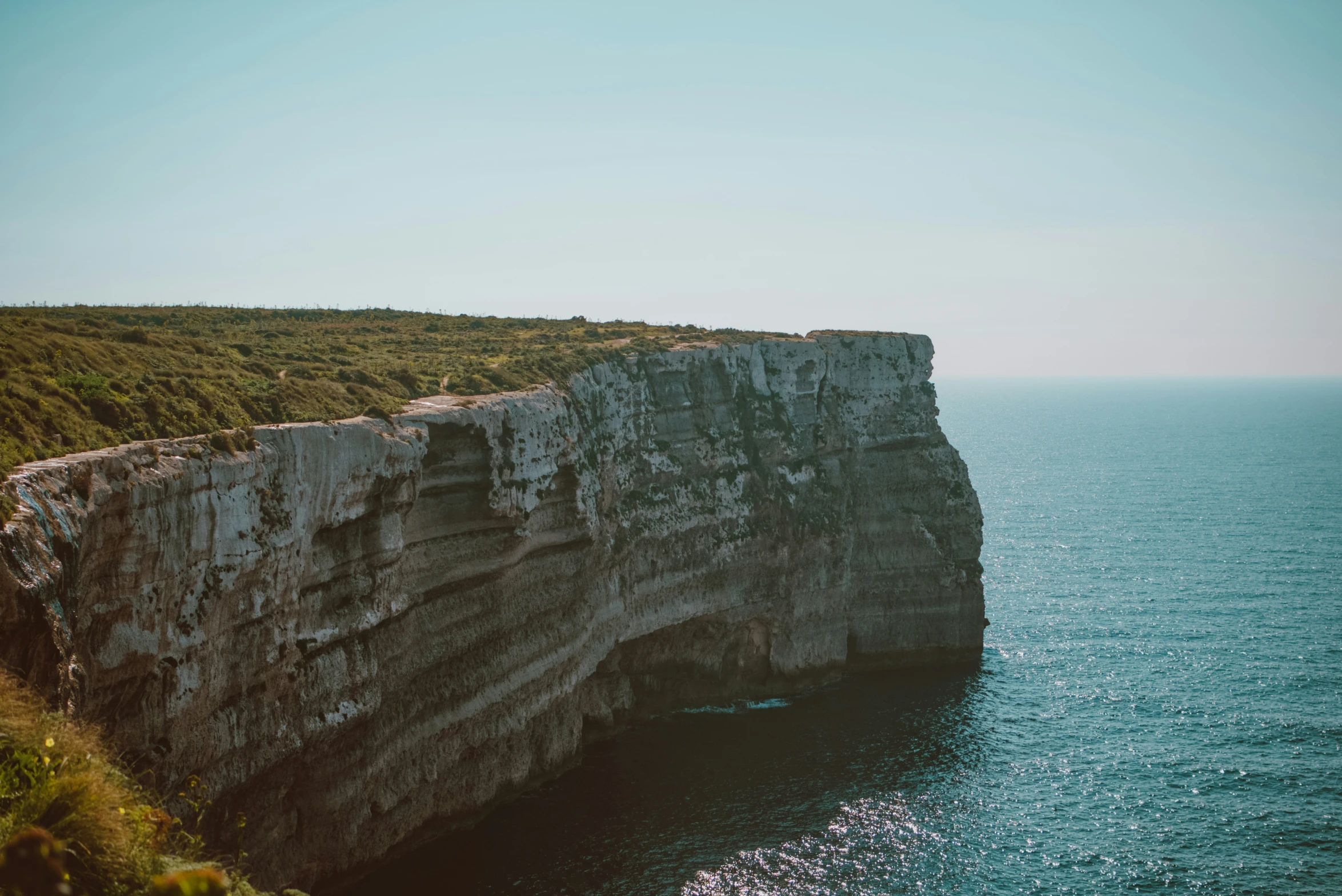 the cliff looks like it's going to be built into a cliff