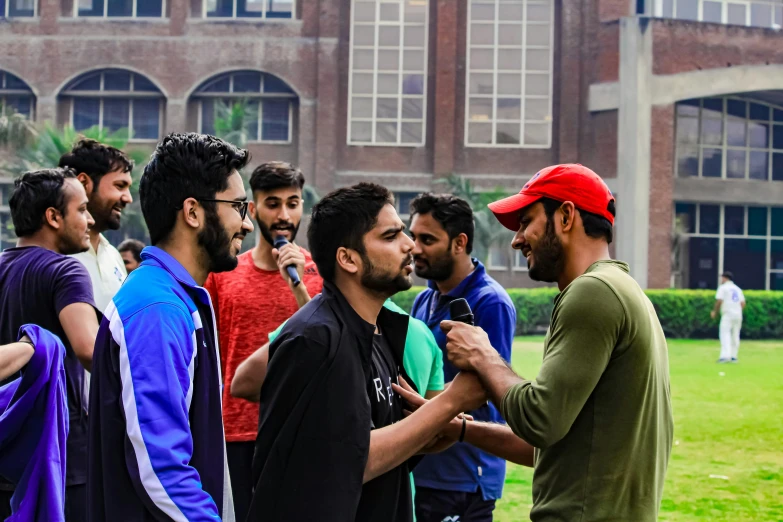 men wearing ties in a group outdoors near a building