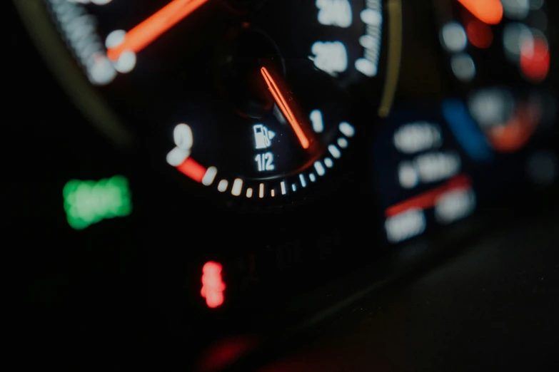 a dashboard in an automobile shows the speed at an angle
