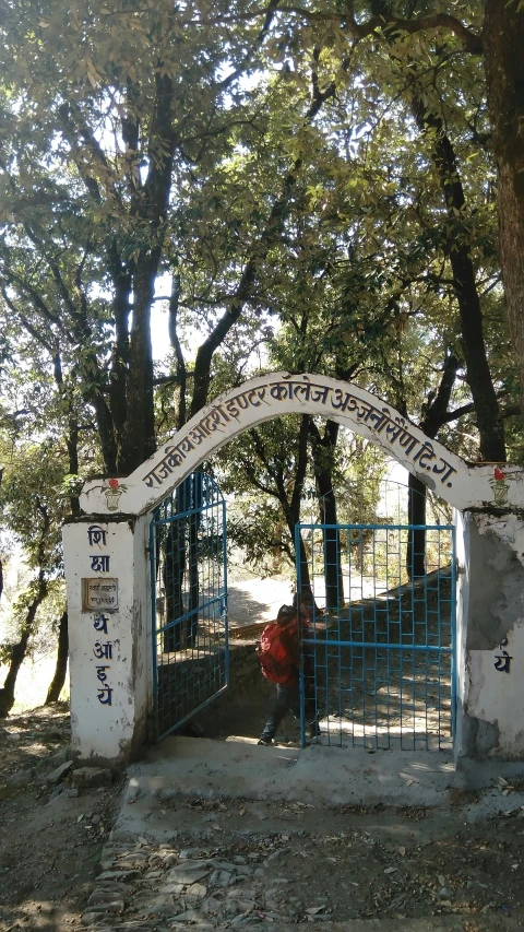 the gate to the property has writing on it