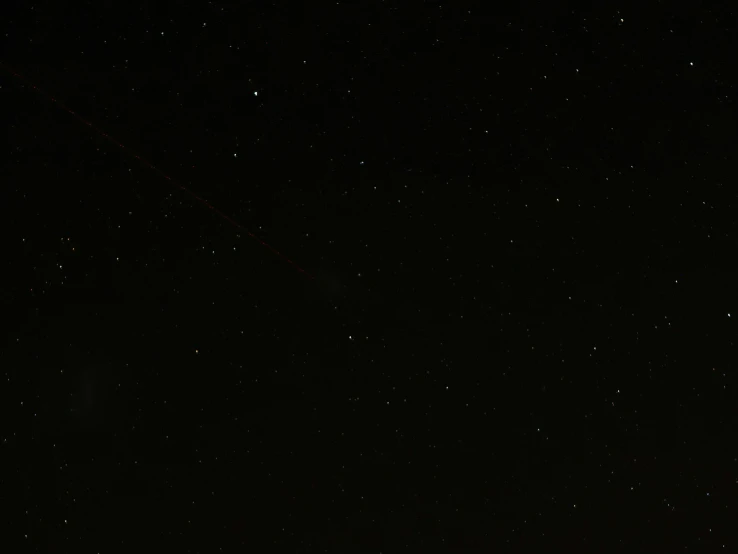 a man and his kite in the dark sky