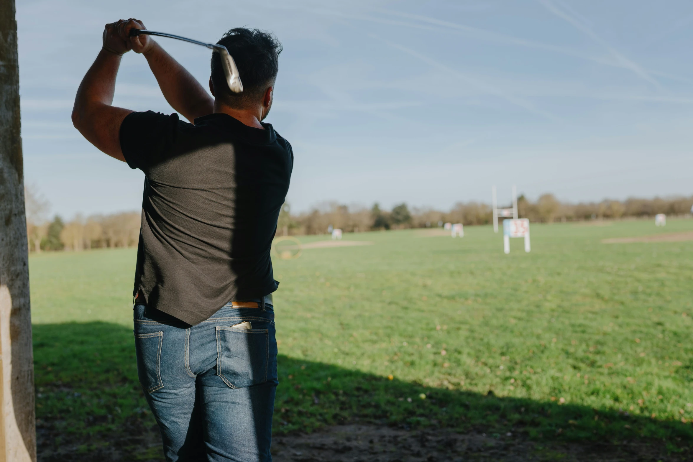 a man playing golf with his driver