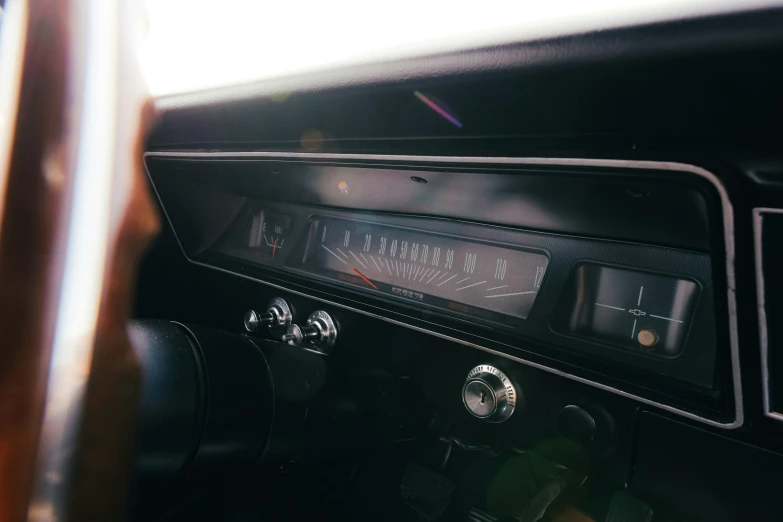 a close up of a dashboard of an old fashioned car