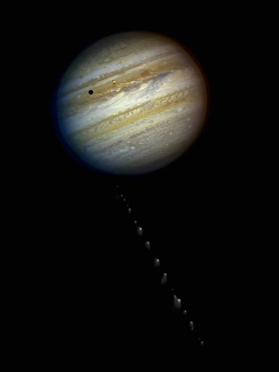 a space shuttle flying past the earth with its shadow