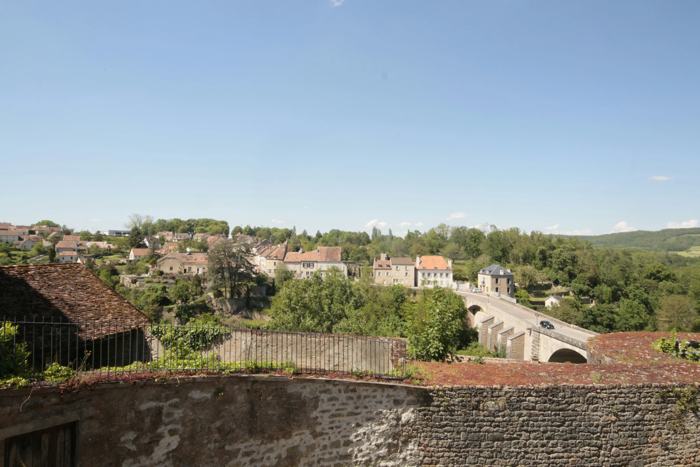 the bridge is built above the city in the mountains