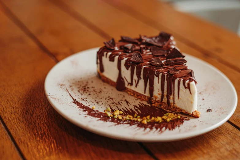 a desert is topped with chocolate and drizzled with chocolate