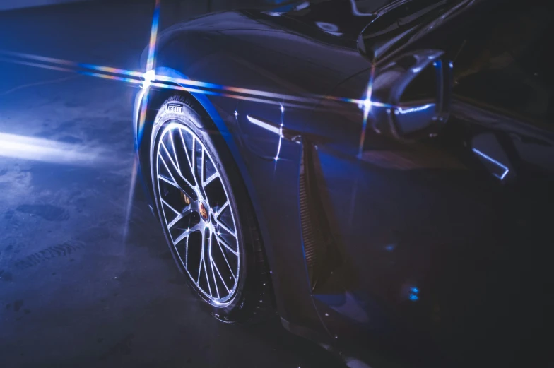 a close up of a car driving in the dark