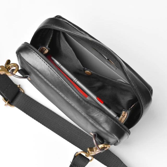 a black leather bag on a white background