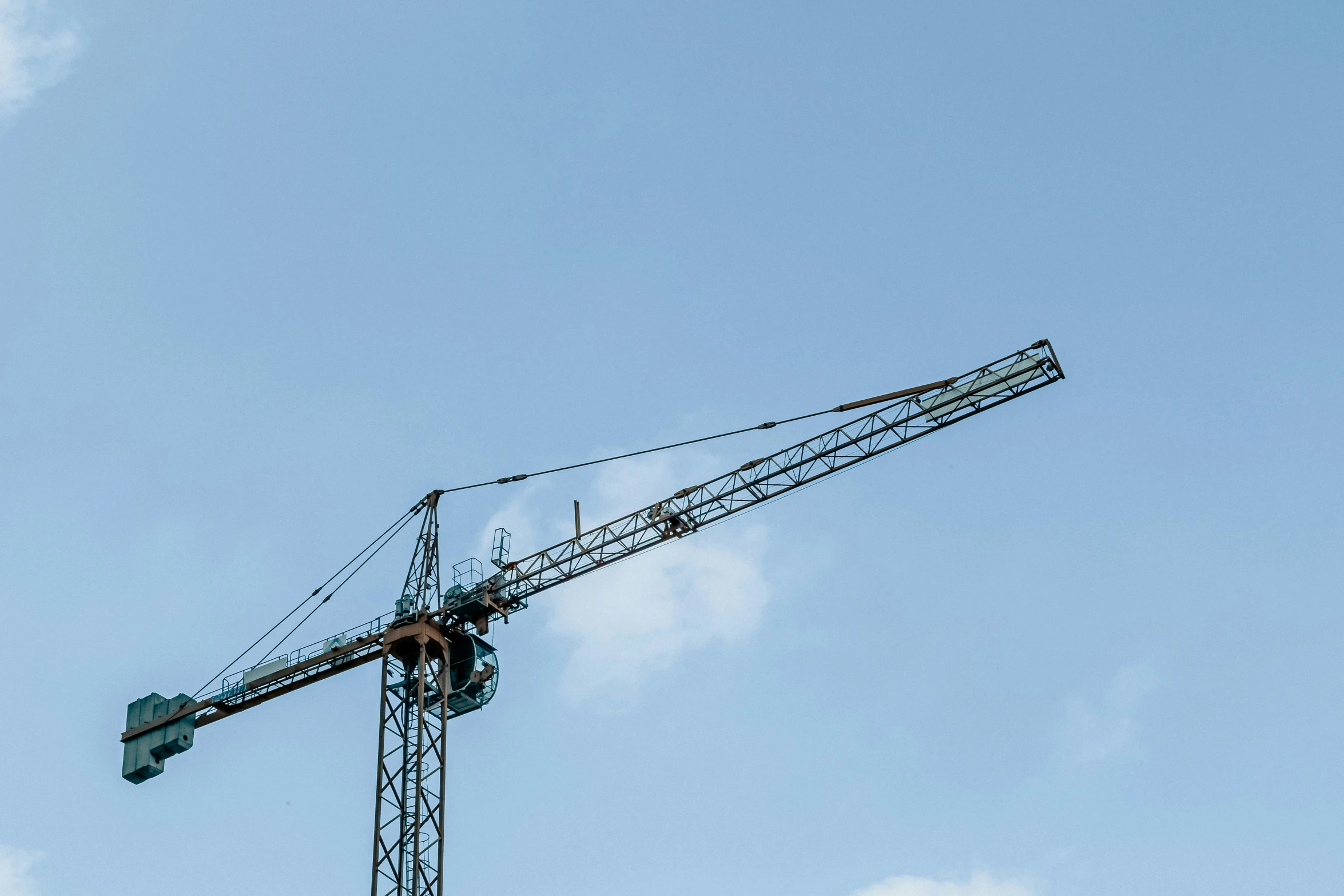 an industrial crane is on a metal pole