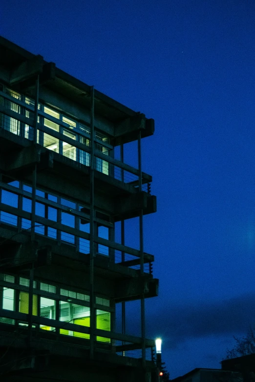 a tall building with several levels in front of it