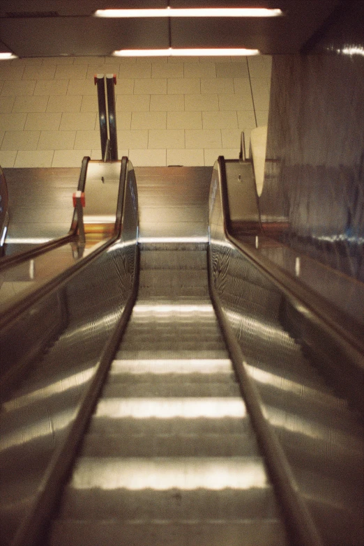 a gray escalator is in an indoor area