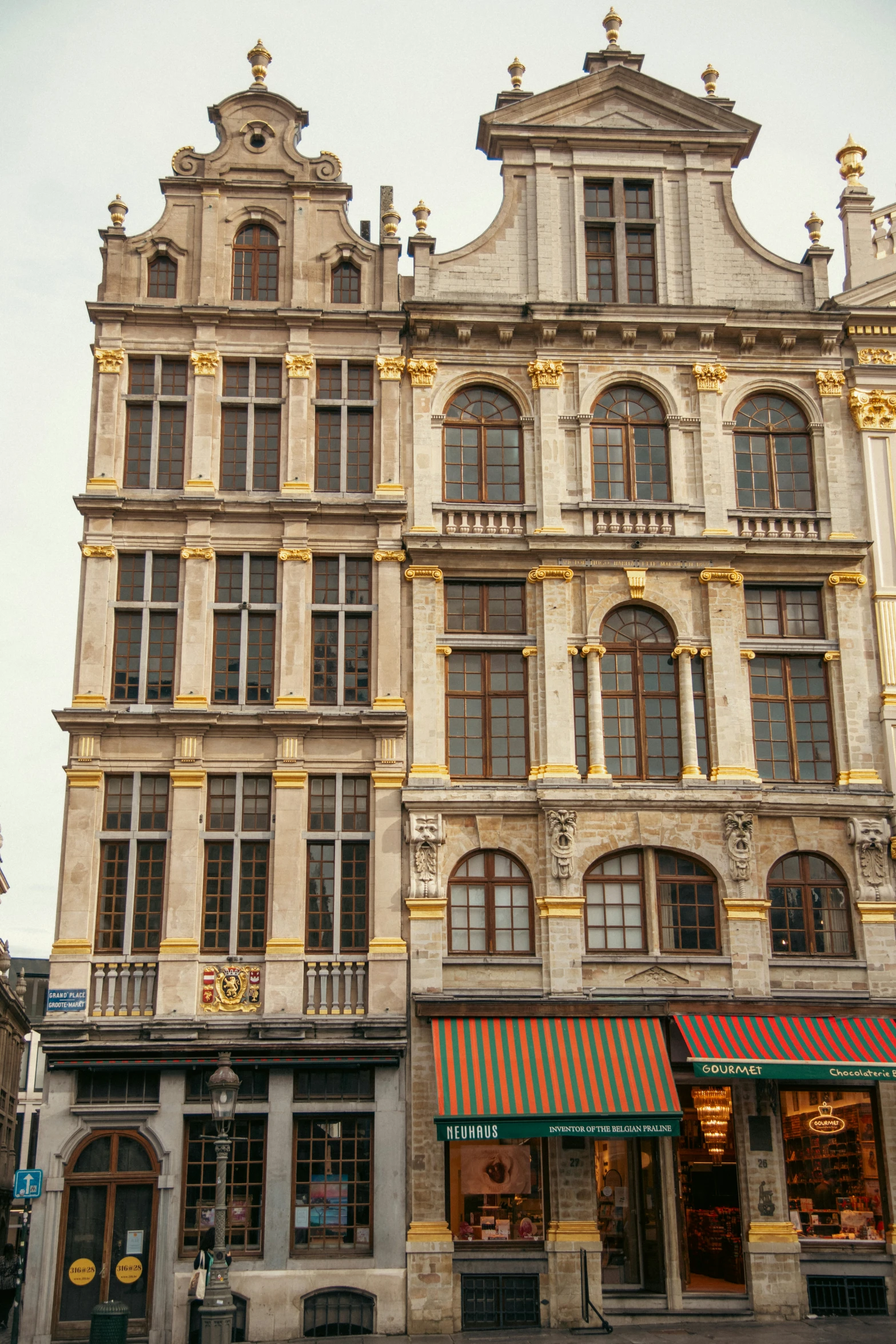 a store with many windows next to a street