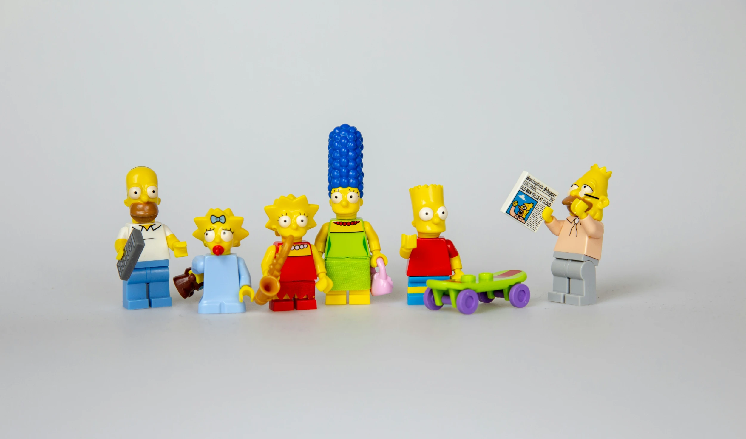 several lego pieces with the simpsons characters standing in a row