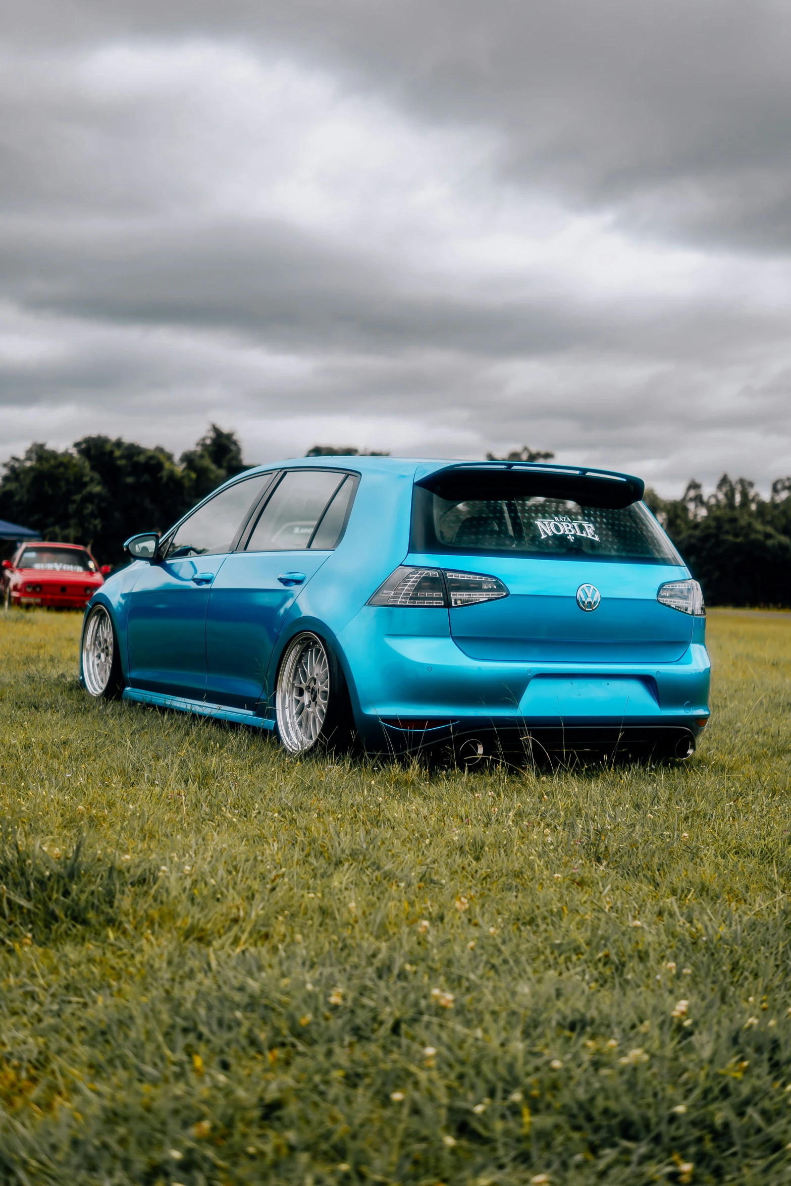 an unusual looking car parked in a field