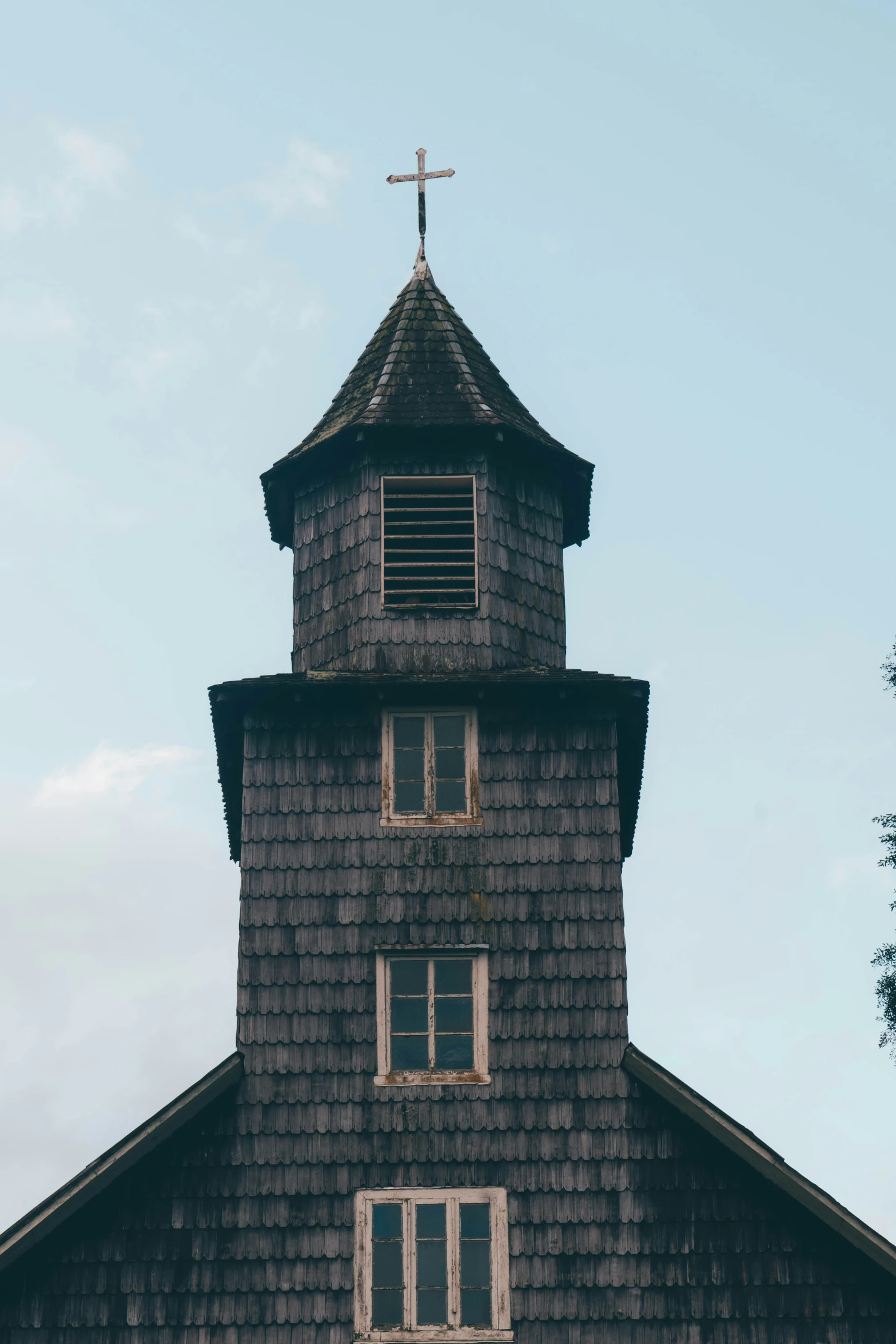 a church steeple has a small window