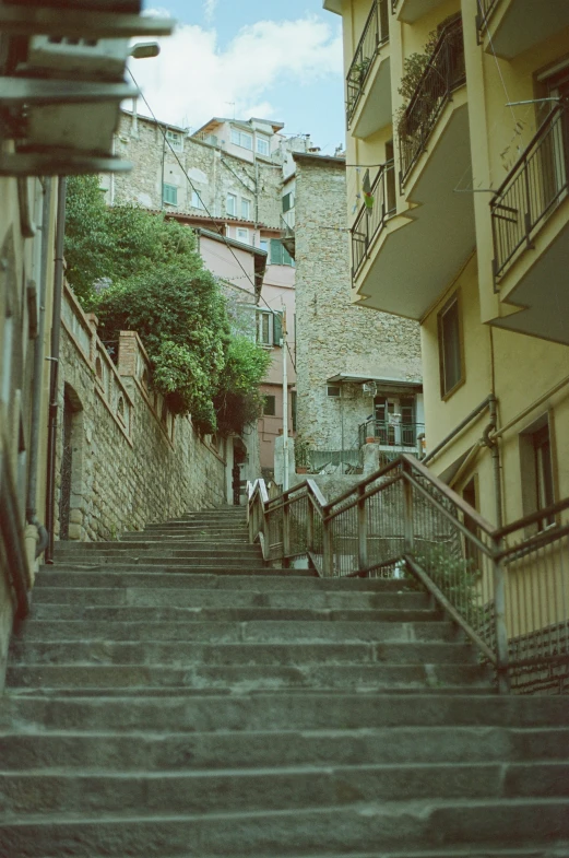 some people walking down some steps in a city