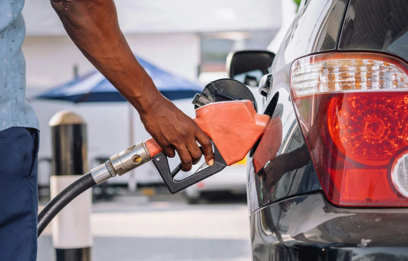 a car being filled with fuel at a gas station