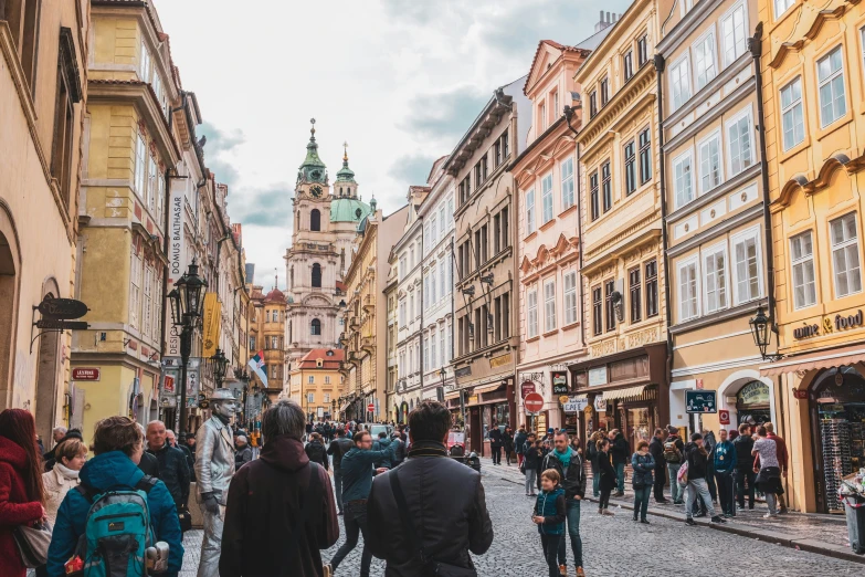 people walk through the old street of some sort