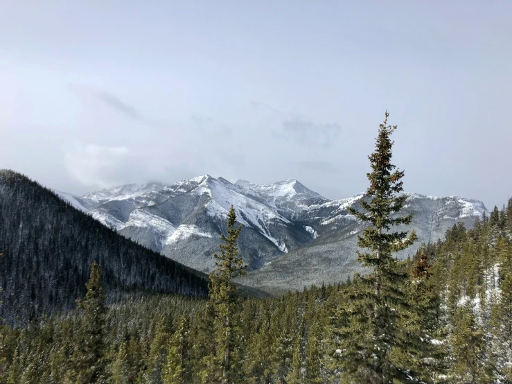 the snow - capped mountains in this area are clear with little snow