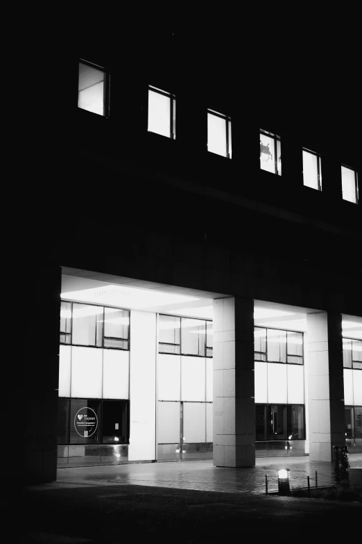 a large building with the lights on from below