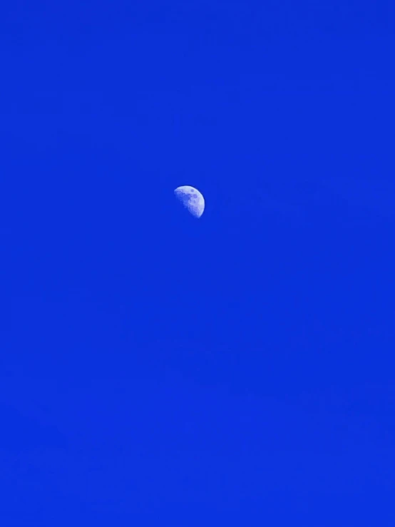 a half moon is seen in the sky on the night