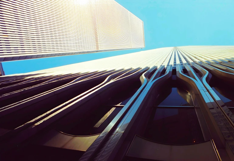 a very tall building near a blue sky