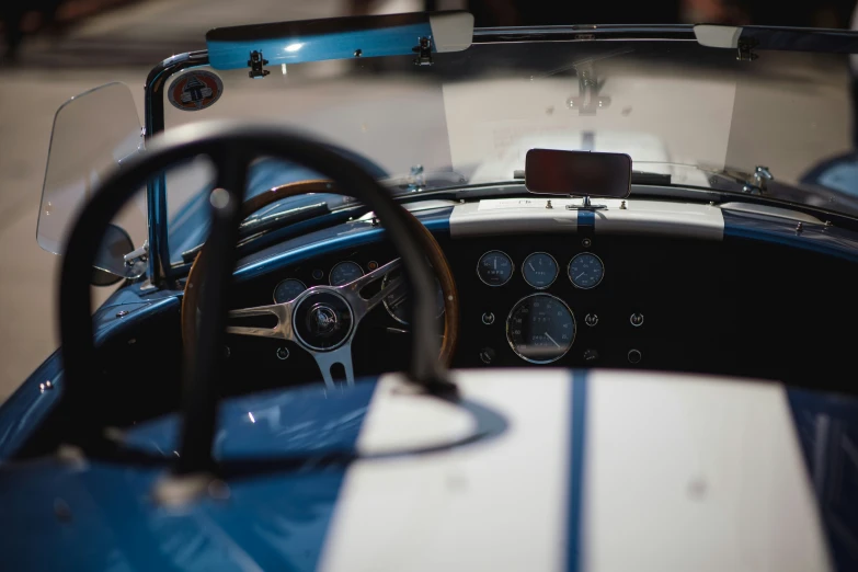 a car inside an old race car showing the dashboard