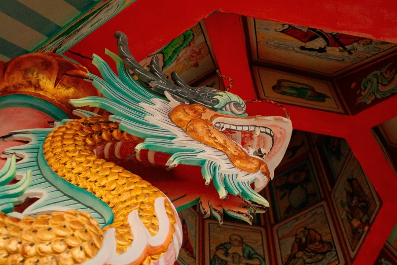 a dragon statue in an asian style temple