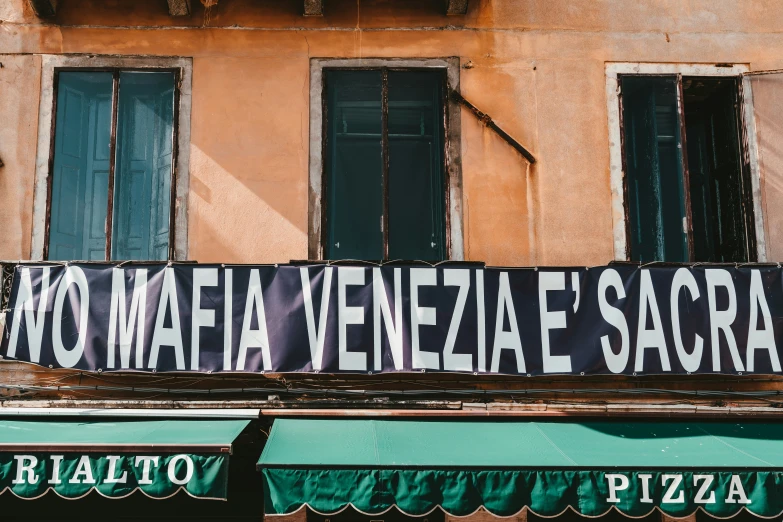 a sign outside a restaurant in an italian country