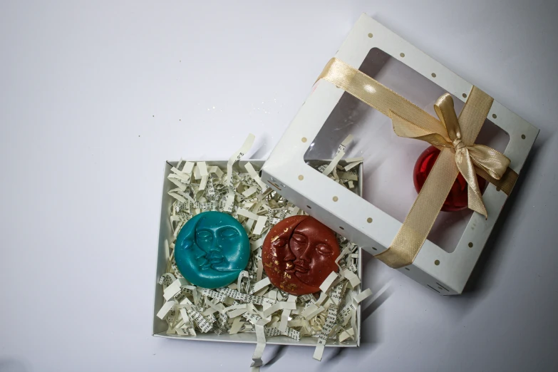 two small cookies with decorations on the inside