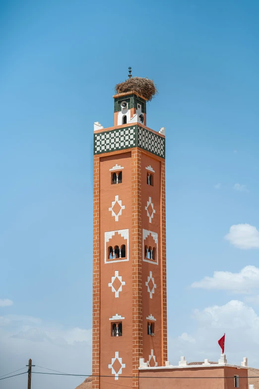 the top of a tower is tiled with designs