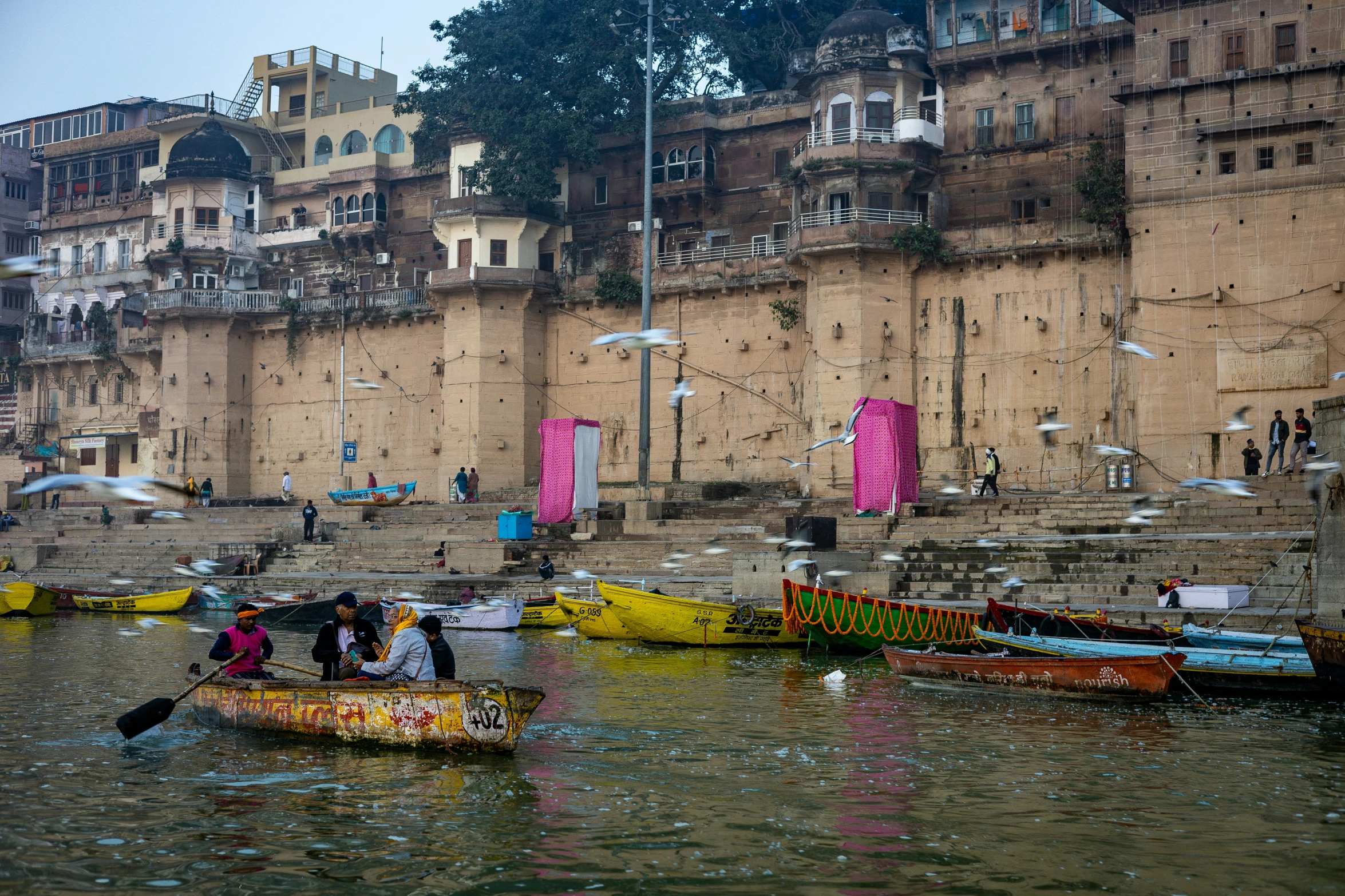 a group of people in canoes on the river