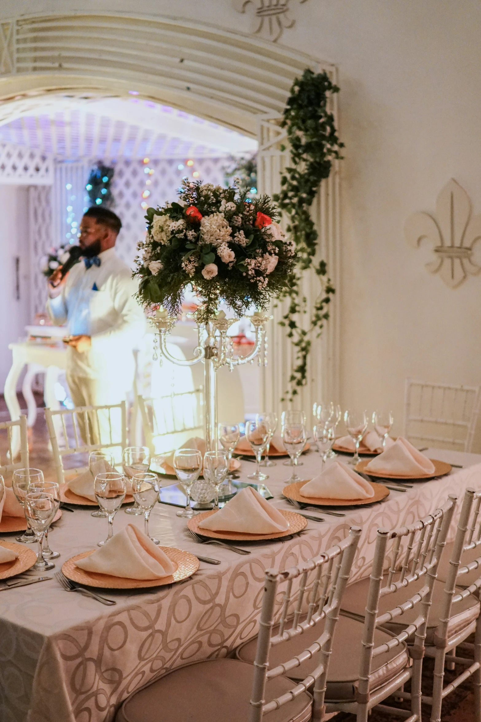 a long table is set up with candles and flowers