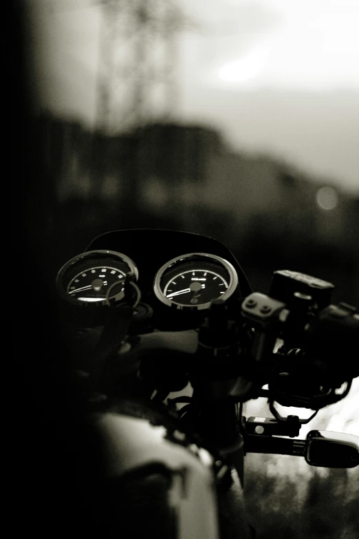 the dashboard of a motor cycle in a blurry po