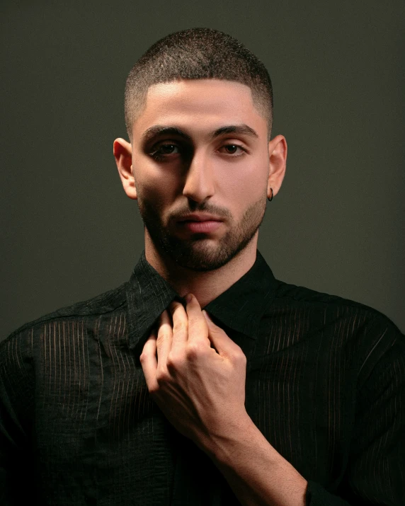 man in shirt and tie adjusting his collar