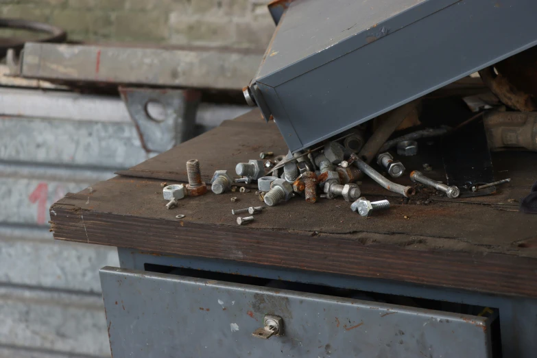 various pipe and nut holders under a metal structure