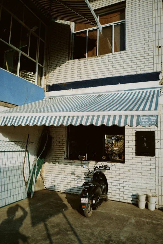 a bike is parked next to a shop