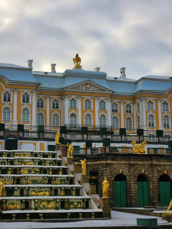 the front of a building, showing stairs and decorations