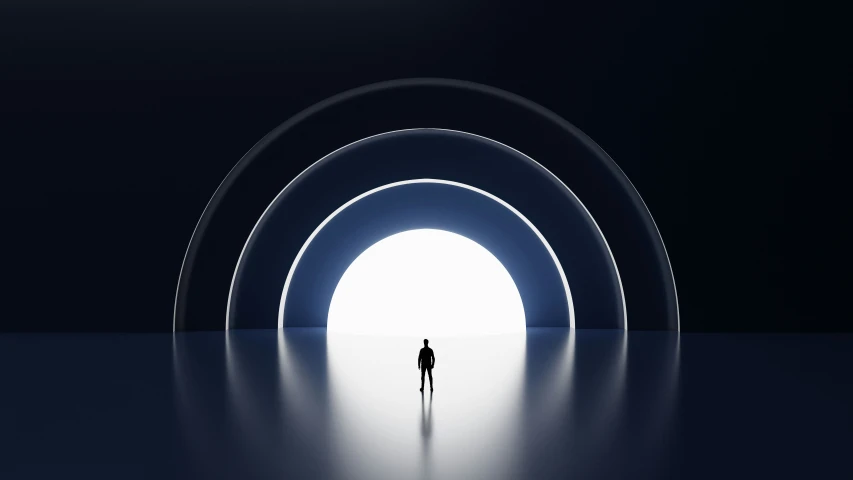 a man standing in the middle of a tunnel