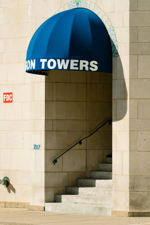 a blue umbrella over the top of a building