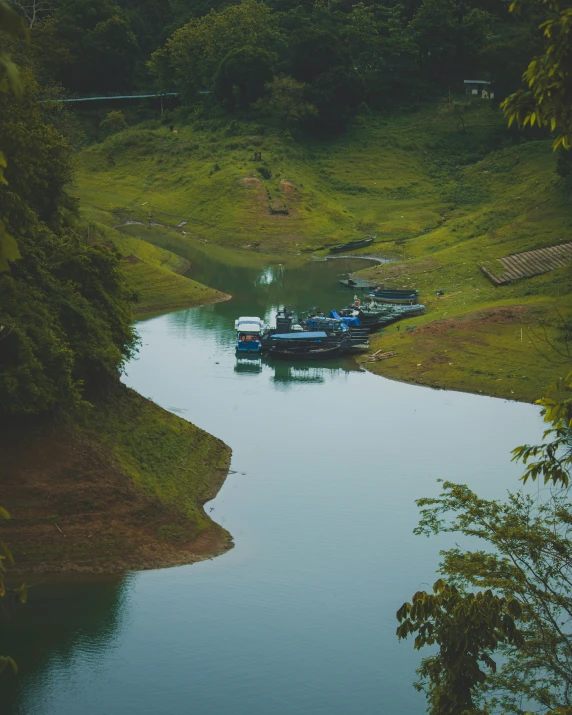 a group of three boats that are in the water