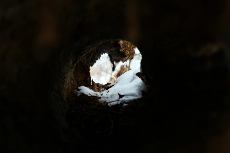 a view of snow in the center of a small hole