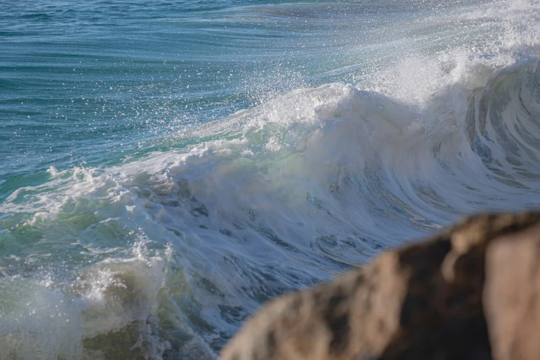 there is a surfboard being carried by the waves