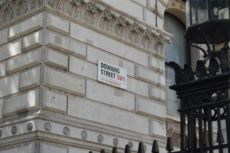 a street sign posted on the side of a building