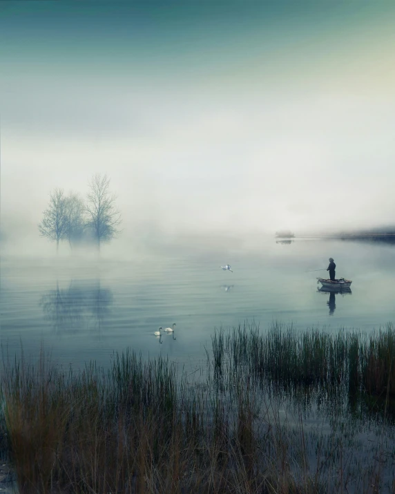 a foggy day with a single person in the boat