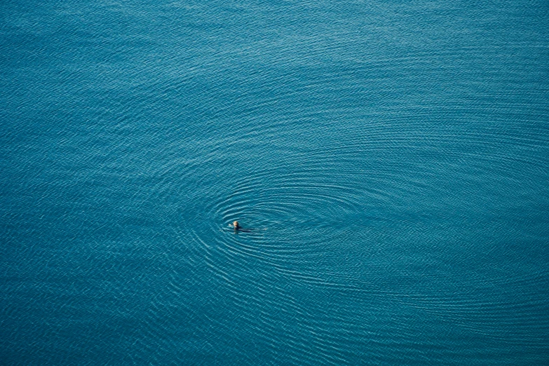 a boat on the water, from above