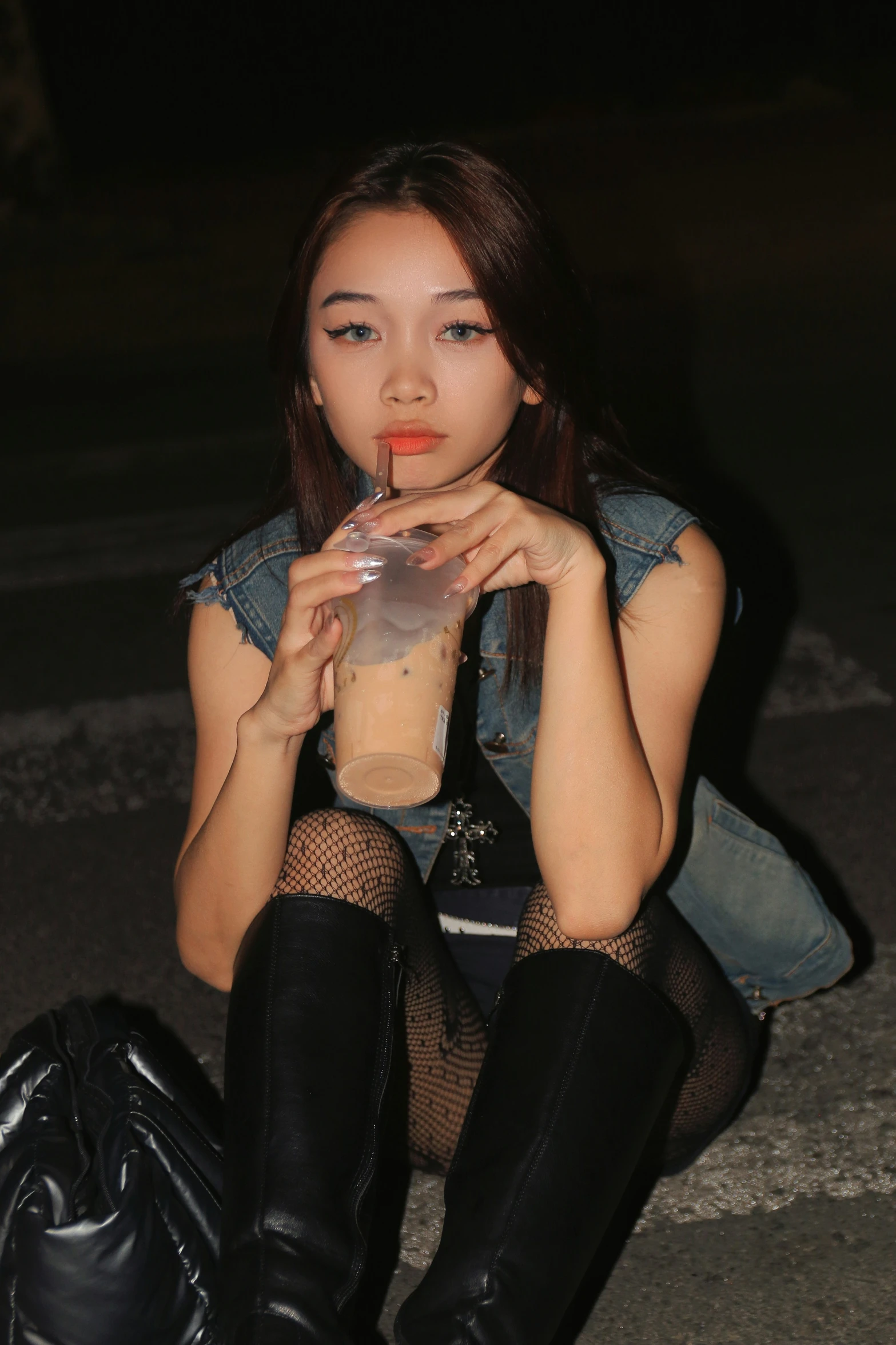 a girl wearing boots and sheer socks