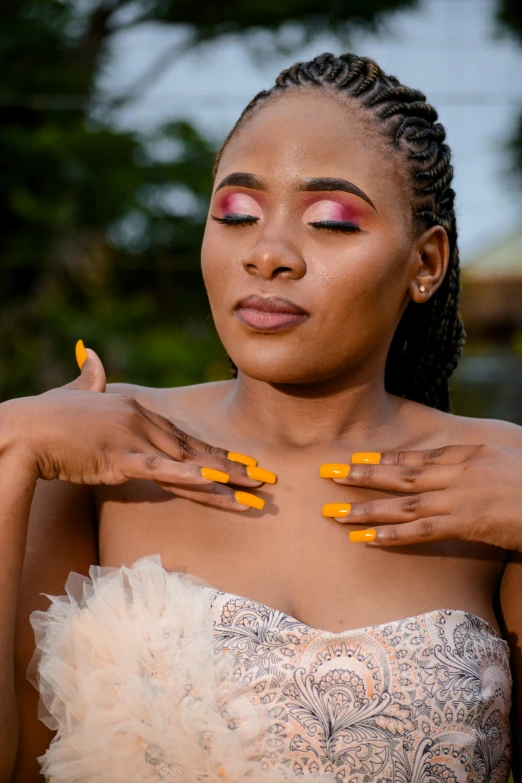 a woman with orange eyes and yellow tips