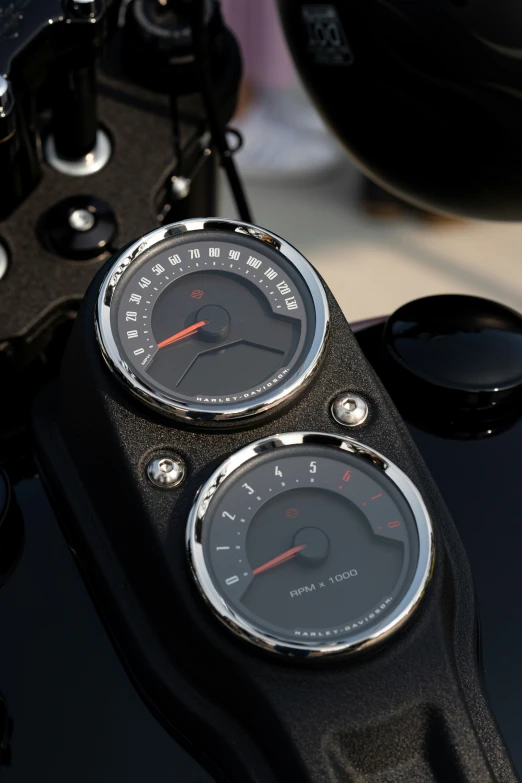 an old motorcycle shows its speed and gauges