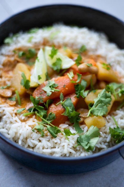 a close up of rice and vegetables in a bowl